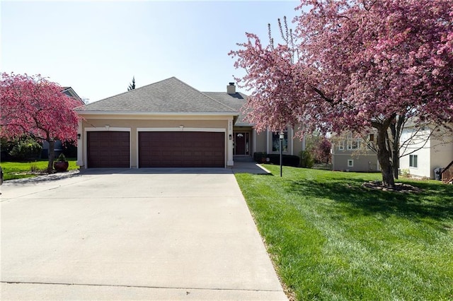 3015 SW 9th Ter, Lees Summit, MO 64081 - view of front of house with concrete driveway, stucco siding, a front yard, a garage, and a shingled roof