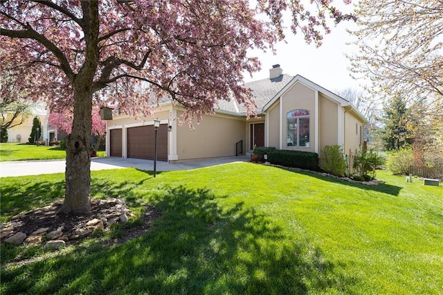 3015 SW 9th Ter, Lees Summit, MO 64081 - view of front of house featuring an attached garage, a chimney, concrete driveway, and a front yard