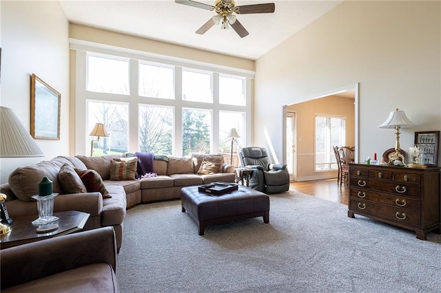 3015 SW 9th Ter, Lees Summit, MO 64081 - living room with a towering ceiling, a ceiling fan, and carpet