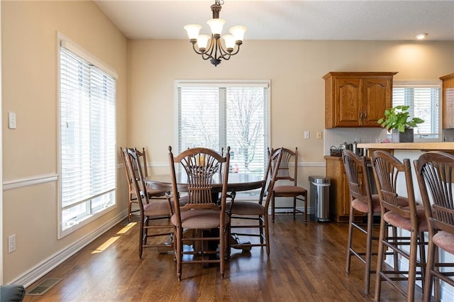 3015 SW 9th Ter, Lees Summit, MO 64081 - dining room featuring a chandelier, visible vents, baseboards, and dark wood finished floors
