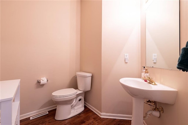 3015 SW 9th Ter, Lees Summit, MO 64081 - half bath with visible vents, baseboards, toilet, and wood finished floors