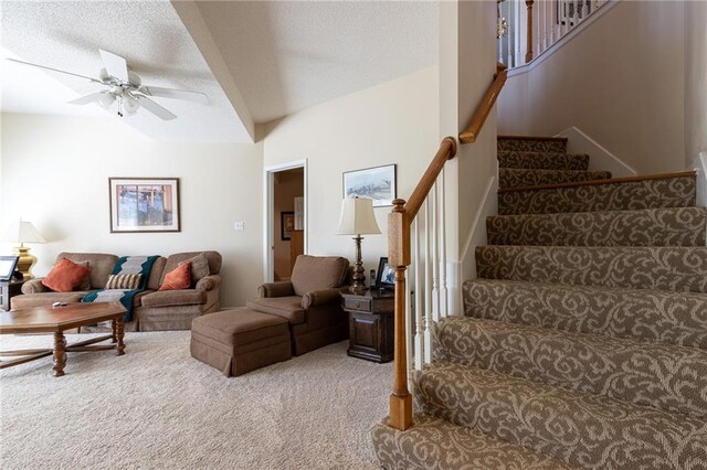 3015 SW 9th Ter, Lees Summit, MO 64081 - carpeted living area with ceiling fan, lofted ceiling, and stairway