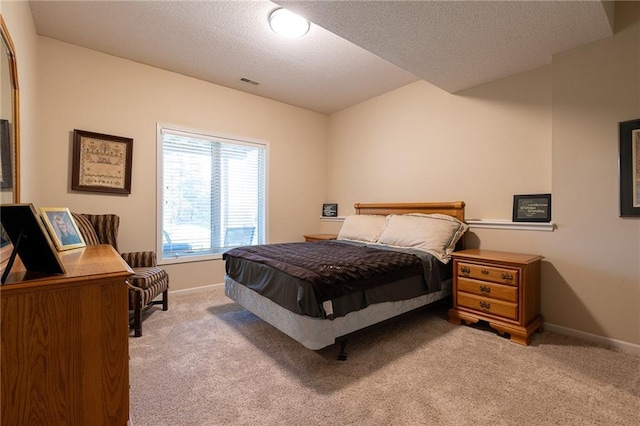 3015 SW 9th Ter, Lees Summit, MO 64081 - bedroom with carpet flooring, visible vents, baseboards, and a textured ceiling