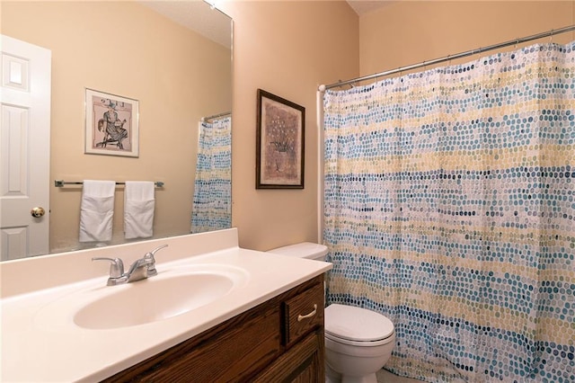 3015 SW 9th Ter, Lees Summit, MO 64081 - bathroom featuring curtained shower, vanity, and toilet