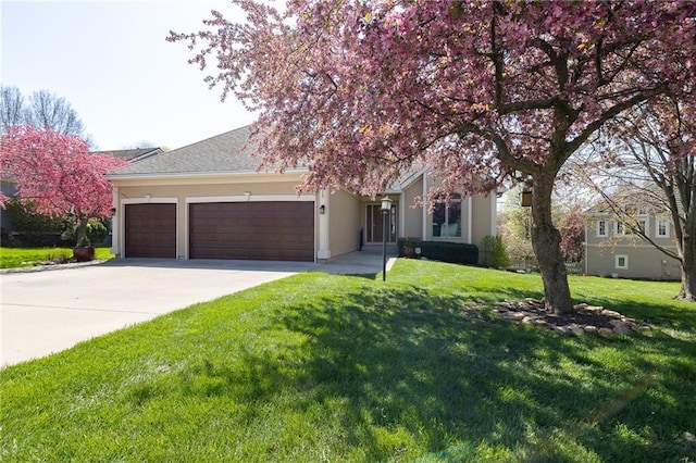 3015 SW 9th Ter, Lees Summit, MO 64081 - view of property hidden behind natural elements featuring a garage, stucco siding, driveway, and a front lawn