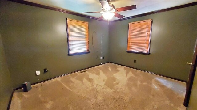 616 E Jackson E, Jackson, Pittsburg, KS 66762 - unfurnished room with carpet flooring, crown molding, and ceiling fan