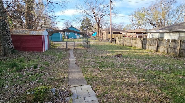 616 E Jackson E, Jackson, Pittsburg, KS 66762 - view of yard featuring an outbuilding, fence, and a storage shed