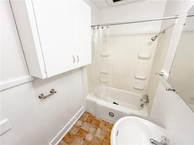 full bath featuring shower / tub combo with curtain