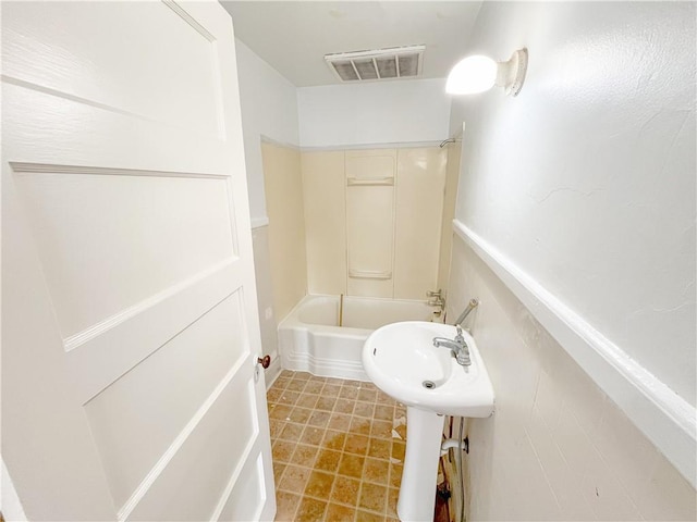bathroom featuring visible vents and shower / washtub combination