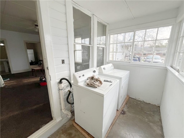 clothes washing area with laundry area and washer and clothes dryer