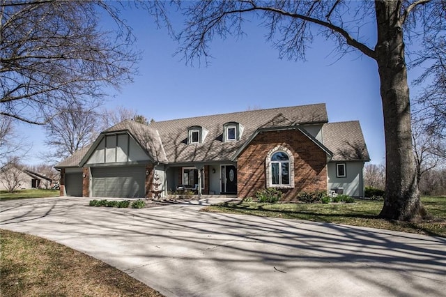 9701 Timber Meadows Dr, Lees Summit, MO 64086 - tudor home with a garage, a porch, concrete driveway, and a shingled roof
