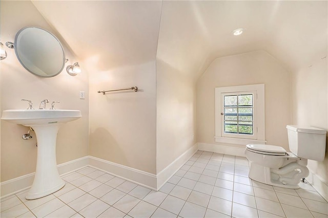 5760 Ward Pkwy, Kansas City, MO 64113 - bathroom with toilet, baseboards, vaulted ceiling, and tile patterned flooring