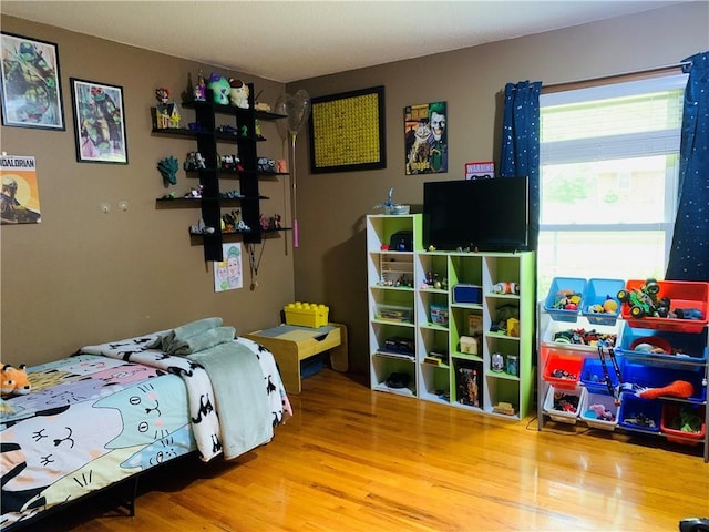 bedroom with wood finished floors