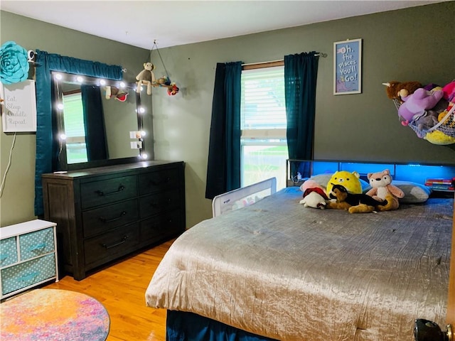 bedroom with wood finished floors