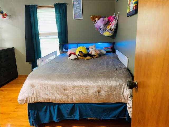 bedroom featuring wood finished floors