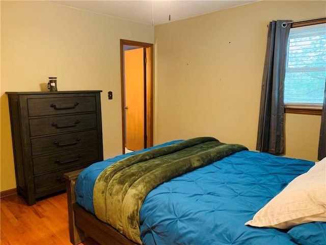 bedroom with wood finished floors
