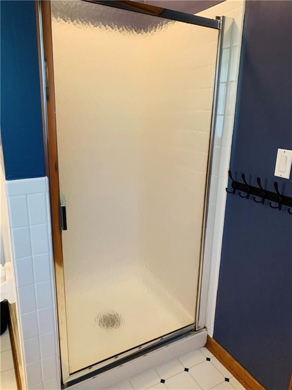 bathroom featuring a shower stall