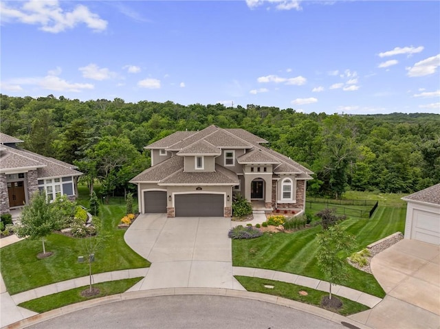 9238 Marion St, Lenexa, KS 66220 - view of front of house with a view of trees, driveway, a garage, stucco siding, and roof with shingles