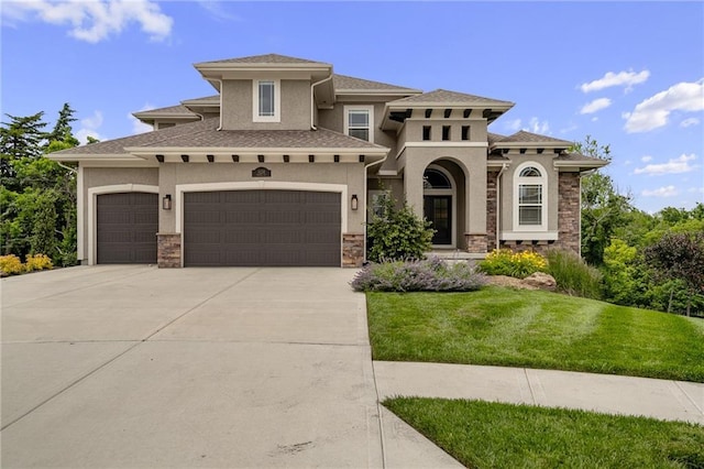 9238 Marion St, Lenexa, KS 66220 - mediterranean / spanish house featuring stucco siding, concrete driveway, a front lawn, and stone siding