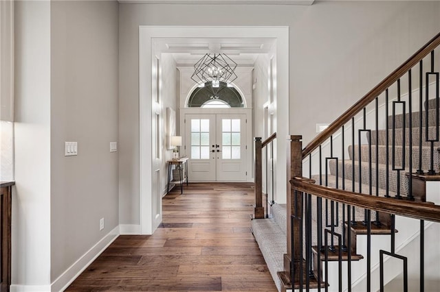 9238 Marion St, Lenexa, KS 66220 - foyer with wood finished floors, stairway, a chandelier, french doors, and baseboards