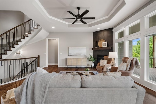 9238 Marion St, Lenexa, KS 66220 - living area with a raised ceiling, baseboards, wood finished floors, ceiling fan, and a fireplace
