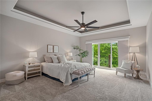 9238 Marion St, Lenexa, KS 66220 - carpeted bedroom featuring a raised ceiling, baseboards, and ceiling fan