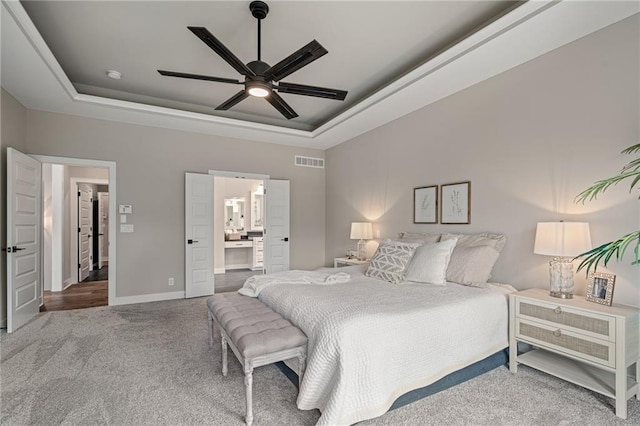 9238 Marion St, Lenexa, KS 66220 - carpeted bedroom with a tray ceiling, baseboards, and ceiling fan