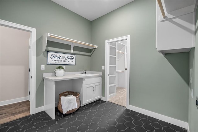9238 Marion St, Lenexa, KS 66220 - laundry room with baseboards and a sink