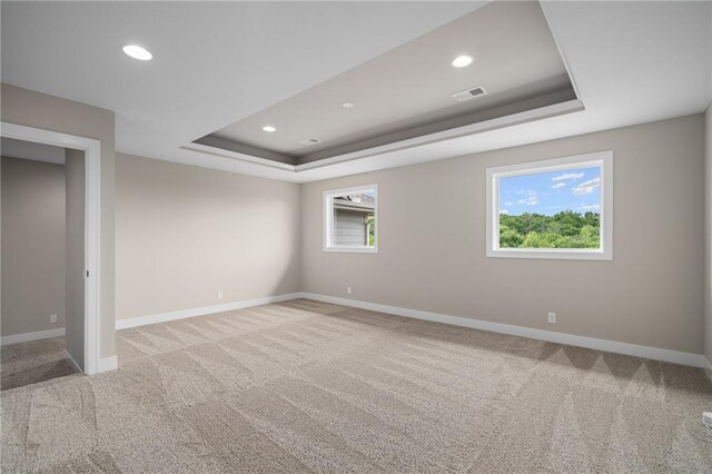 9238 Marion St, Lenexa, KS 66220 - spare room featuring a tray ceiling, carpet, baseboards, and recessed lighting