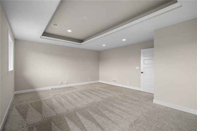 9238 Marion St, Lenexa, KS 66220 - spare room featuring a raised ceiling, recessed lighting, carpet, and baseboards