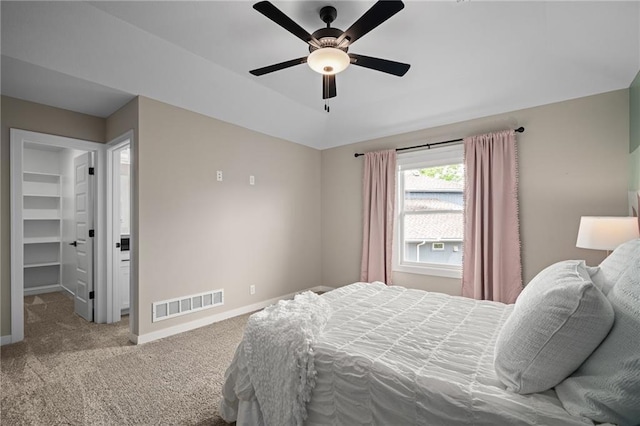 9238 Marion St, Lenexa, KS 66220 - carpeted bedroom with baseboards, a spacious closet, and ceiling fan
