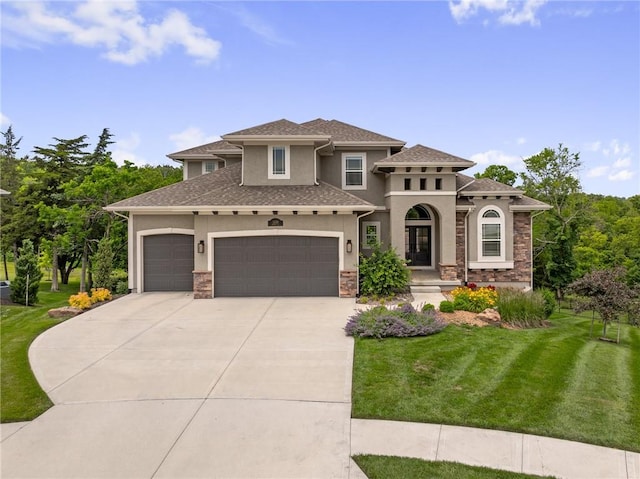 9238 Marion St, Lenexa, KS 66220 - view of front of home with stucco siding, concrete driveway, a front lawn, an attached garage, and stone siding