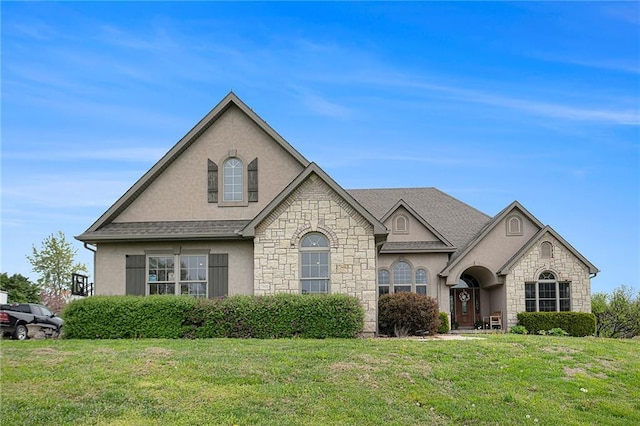 15511 Salem Rd, Excelsior Springs, MO 64024 - french provincial home featuring stone siding, stucco siding, and a front yard