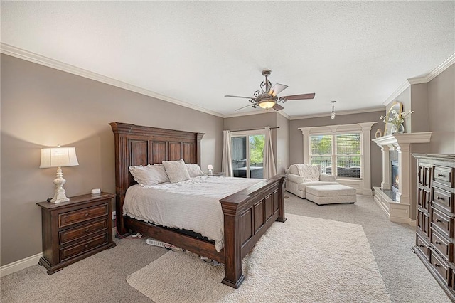 15511 Salem Rd, Excelsior Springs, MO 64024 - bedroom featuring light colored carpet, baseboards, ornamental molding, ceiling fan, and a glass covered fireplace
