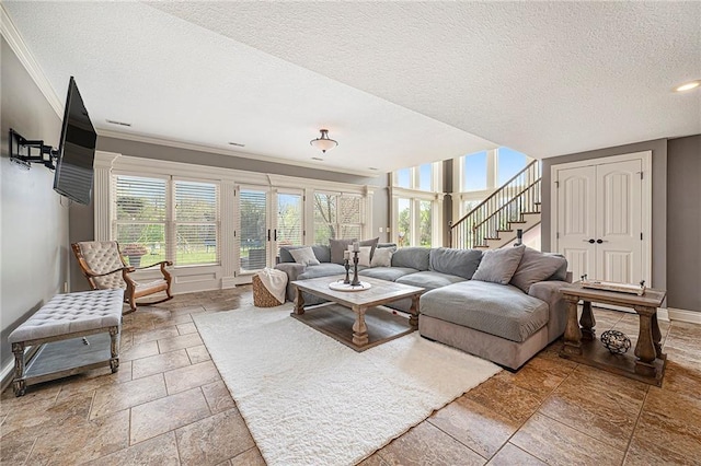 15511 Salem Rd, Excelsior Springs, MO 64024 - living room with stone tile floors, baseboards, crown molding, a textured ceiling, and stairway