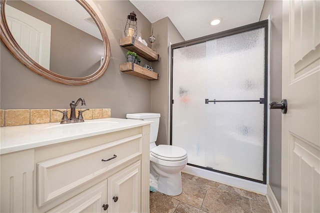 15511 Salem Rd, Excelsior Springs, MO 64024 - full bathroom with a stall shower, vanity, toilet, stone tile flooring, and recessed lighting