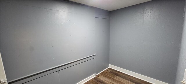 224 Spruce St, Leavenworth, KS 66048 - unfurnished room with baseboards and dark wood-style floors