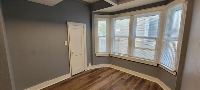 224 Spruce St, Leavenworth, KS 66048 - unfurnished room with dark wood finished floors and baseboards