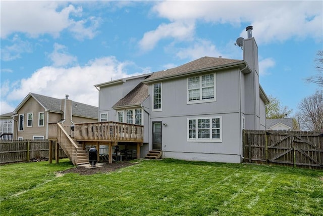 back of property featuring a wooden deck, a yard, a fenced backyard, stairway, and a chimney