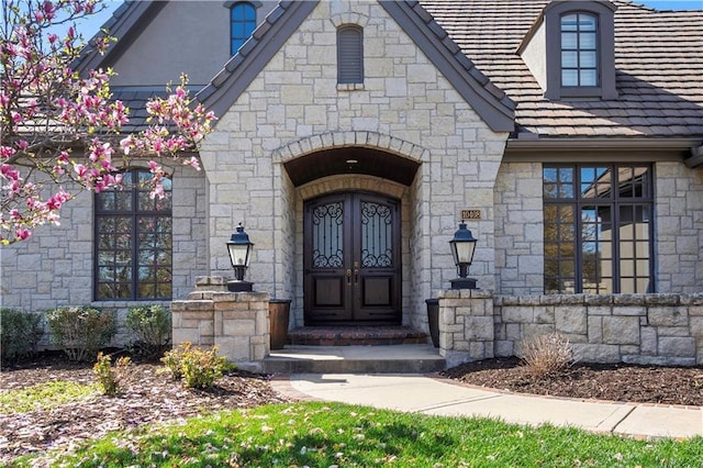 10408 Howe Ln, Leawood, KS 66206 - entrance to property featuring french doors and stone siding