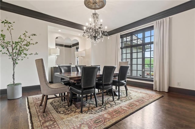 10408 Howe Ln, Leawood, KS 66206 - dining room featuring baseboards, crown molding, wood finished floors, and a notable chandelier