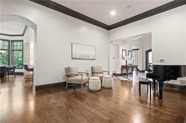 10408 Howe Ln, Leawood, KS 66206 - sitting room featuring visible vents, arched walkways, wood finished floors, baseboards, and ornamental molding