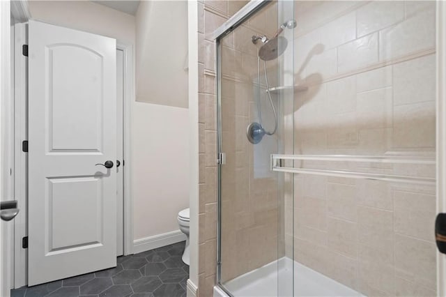 10408 Howe Ln, Leawood, KS 66206 - bathroom featuring toilet, tile patterned floors, and a stall shower