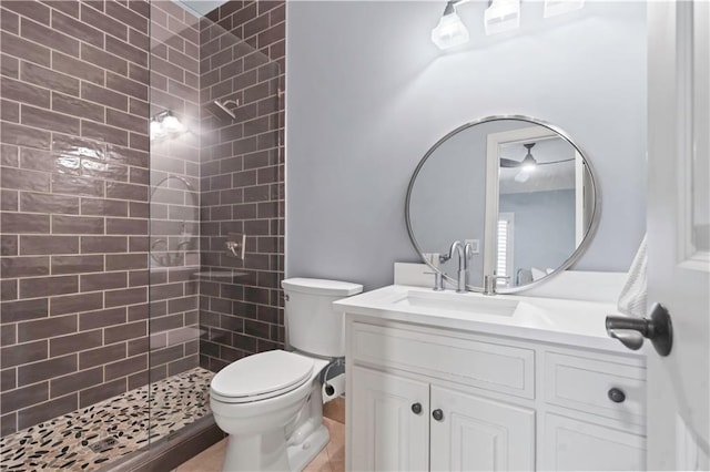 10408 Howe Ln, Leawood, KS 66206 - full bathroom with toilet, a tile shower, and vanity