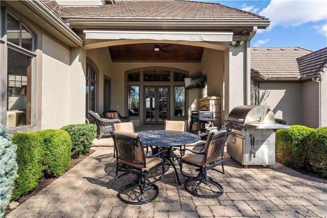 10408 Howe Ln, Leawood, KS 66206 - view of patio with grilling area, french doors, and outdoor dining space