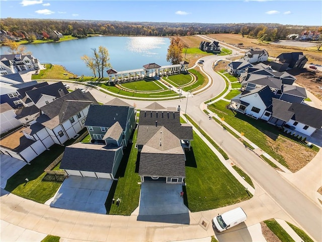 drone / aerial view with a residential view and a water view