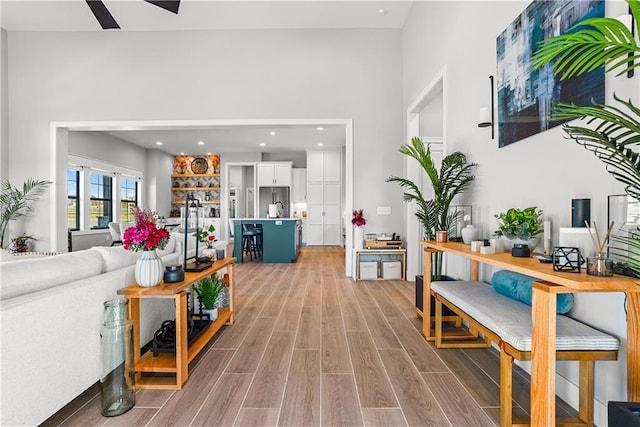 living area with recessed lighting and light wood finished floors