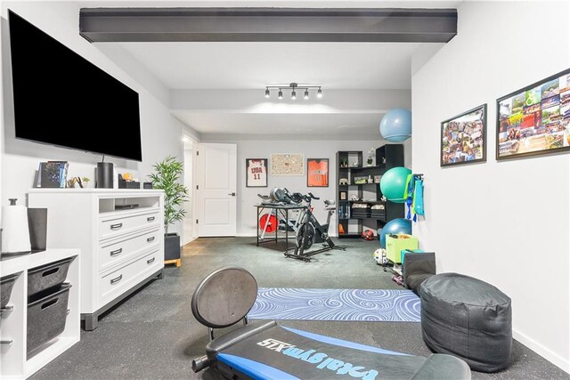 workout room featuring track lighting