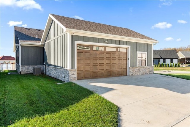 garage featuring cooling unit and driveway