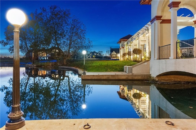 view of pool with a water view